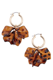Tortoiseshell leaf-shaped earrings on a white background