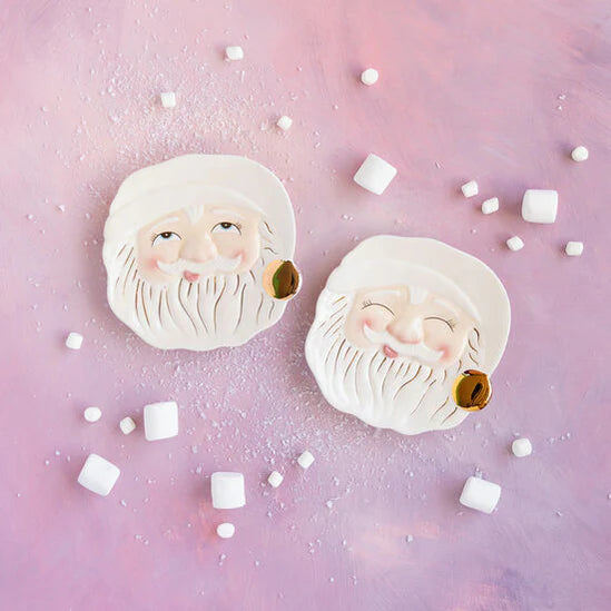 Seasonal - Ivory Papa Noel Plate - 2 Ceramic plates on purple background with marshmallows scattered about. 