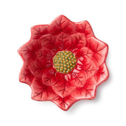 Red ceramic flower-shaped dish on a white background