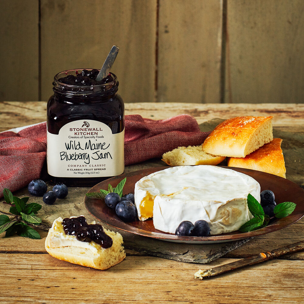 Seasonal - Food Gift - Wild Maine Blueberry Jam by a cheese wheel as a charcuterie display 