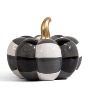 Decorative pumpkin made by Royal standard with black and white striped pattern and gold stem on a white background