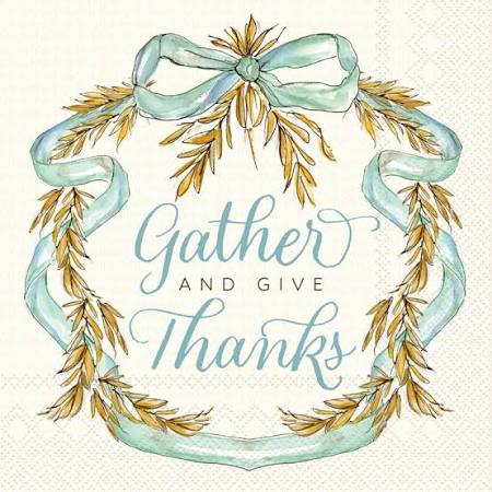 Napkins - Cocktail - Whimsical Wheat- white napkin background with brown wheat wreath with a blue bow with the words “Gather and give thanks”