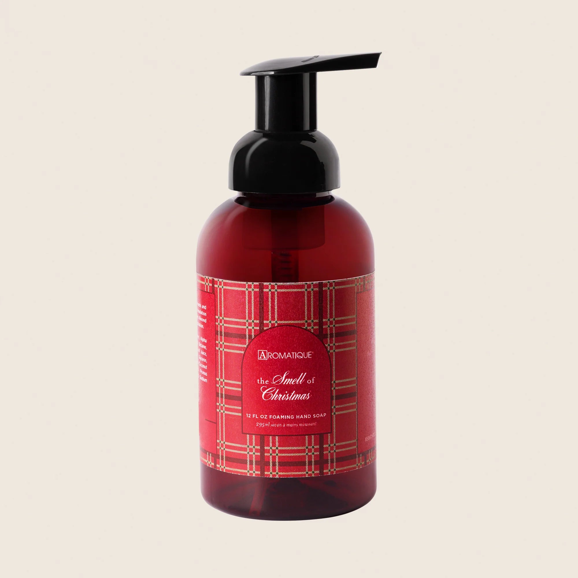 The smell of Christmas candle with red label - beige background 