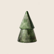 Metallic tree shaped candle on beige background 