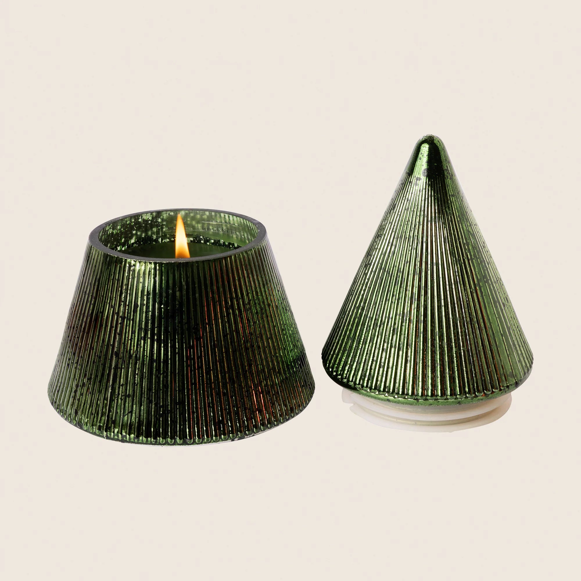 Lot tree shaped candle on beige background 