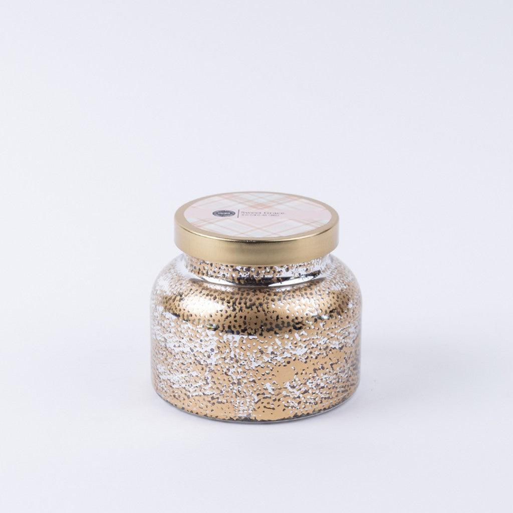 Candle in gold jar container 