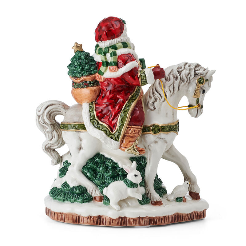 Decorative figurine of a person on a horse with Christmas-themed elements on a white background