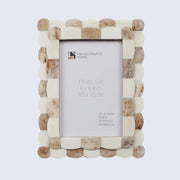 Beige and brown checkered photo frame on a white background
