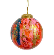 Decorative glass ball ornament with gold accents on a white background