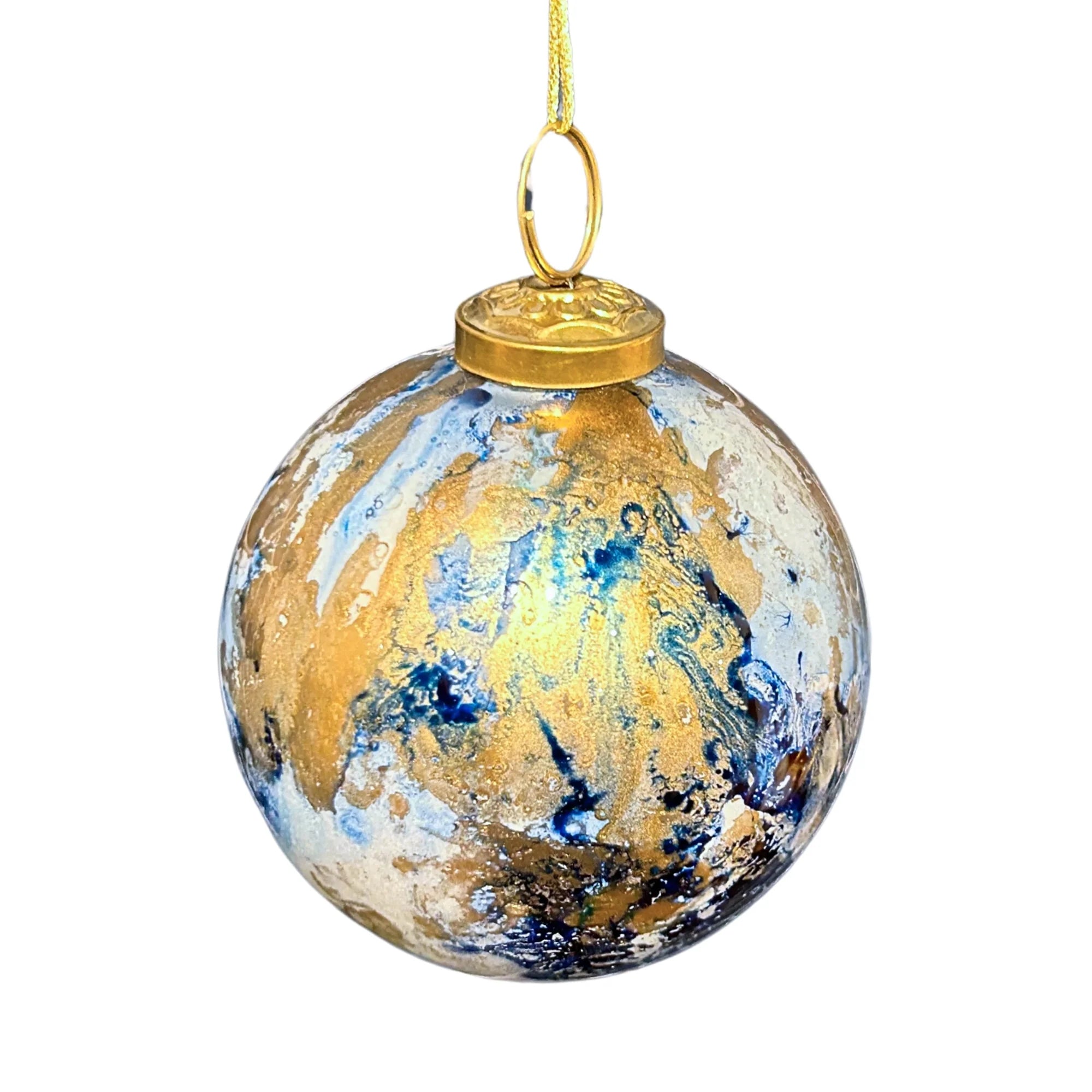 Decorative glass ball ornament with gold, blue, and white abstract design on a white background