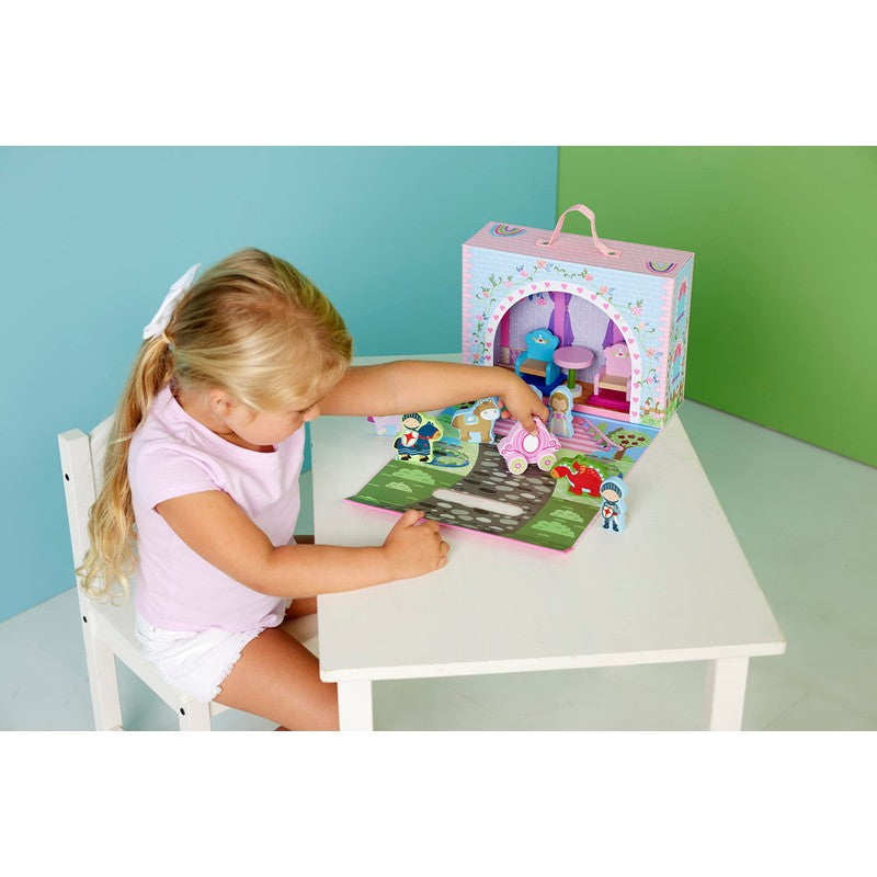 Child playing with a toy set on a table against a colorful wall.
