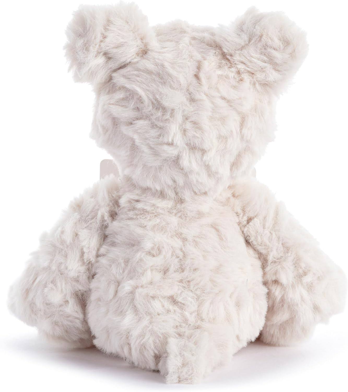 Fluffy white bear plush toy on a white background