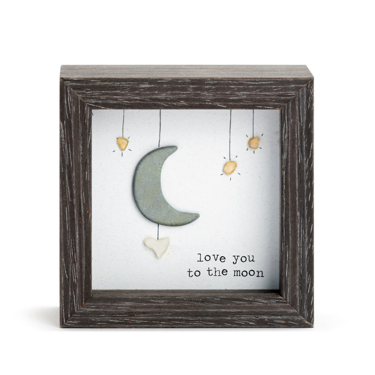Decorative wall art with a moon and stars design in a wooden frame on a white background.