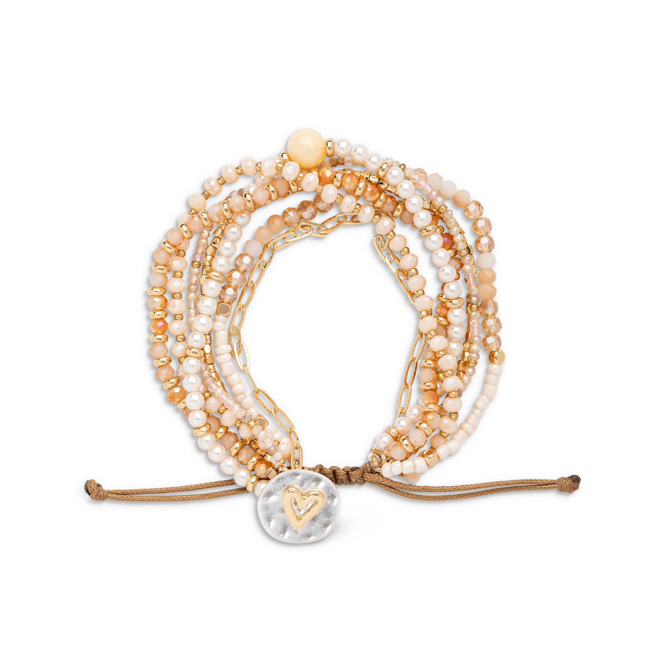 Stack of beaded bracelets with a heart charm on a white background