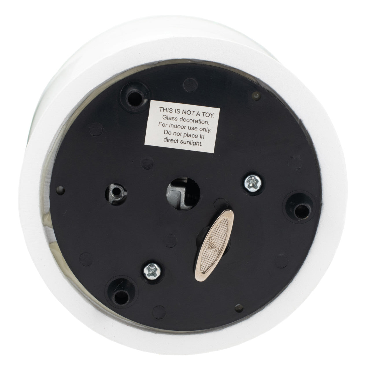Backside of a decorative item with a warning label on a white background