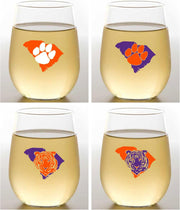Four stemless wine glasses with Clemson University logos filled with white wine on a gray background.