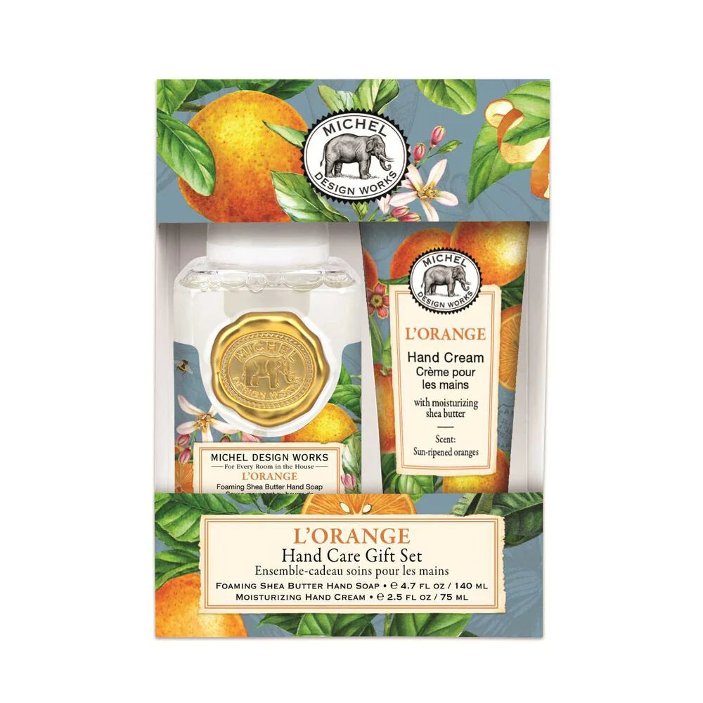 Michel Design Works L'Orange hand care gift set with jar and cream on a decorative background