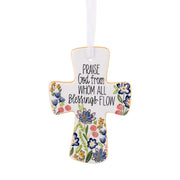 Decorative cross ornament with floral designs and text on a white background