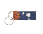 Keychain with South Carolina Flag needlepoint design and leather accent on a white background