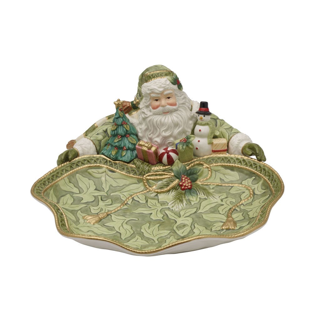 Decorative Christmas scene with Santa Claus, a tree, and a snowman on a green tray.