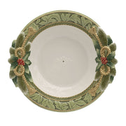 Decorative bowl with green and gold leaf patterns on a white background