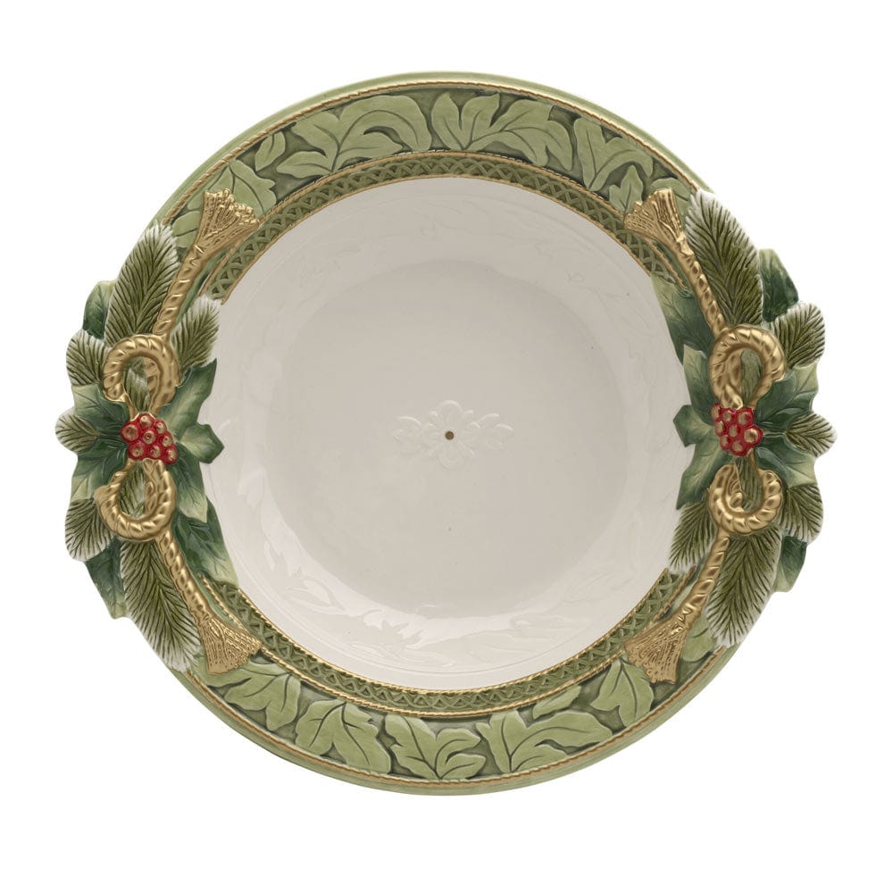 Decorative bowl with green and gold leaf patterns on a white background