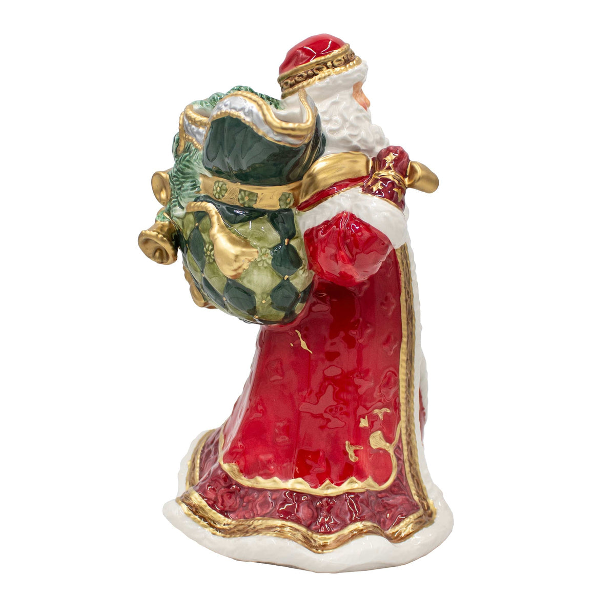 Decorative figurine of a Santa Claus holding a green bag on a white background