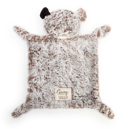 Furry bear-shaped pillow with a visible brand label on a white background
