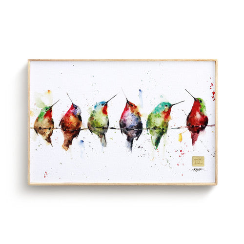 Framed artwork of colorful birds on a wire against a white background