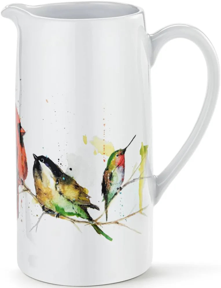 White ceramic pitcher with bird illustrations on a white background