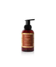 Cinnamon Cider foaming hand soap in a brown bottle on a white background 