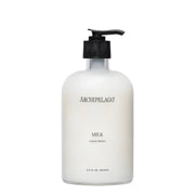 Archipelago Milk Hand Soap in a glass pump bottle on a white background 