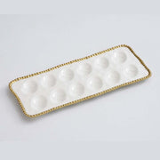 Pampa Bay brand Rectangular white egg tray dish with gold ball rim on a light gray background 
