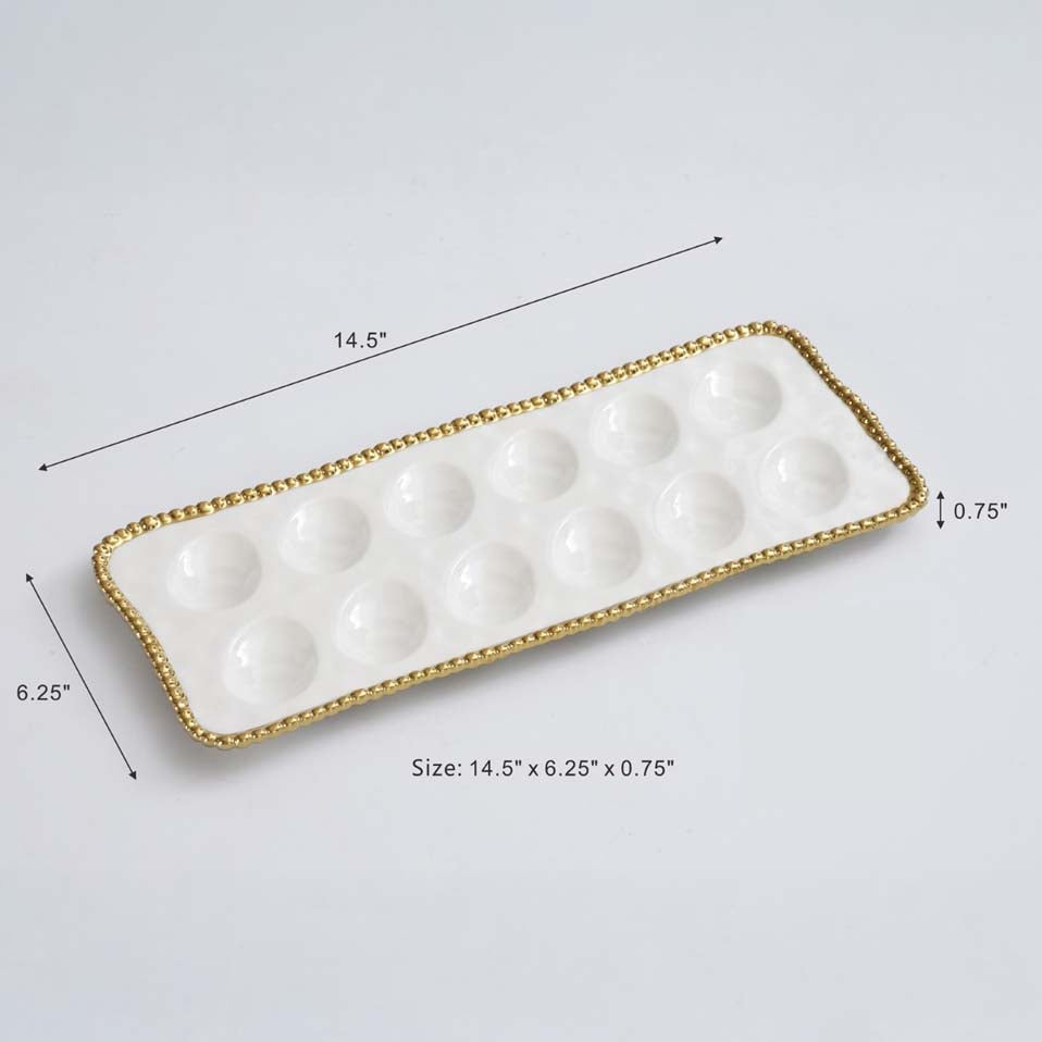 Pampa Bay brand White egg tray with gold rim and measurements on a light gray background
