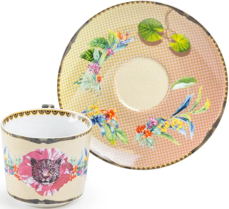 Decorative teacup and saucer with floral and animal design on a white background