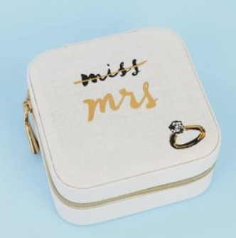 Jewelry box with 'Miss Mrs.' text and a ring on a light blue background