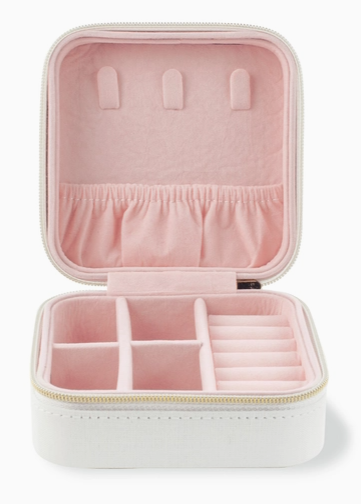 Pink jewelry case with compartments on a white background