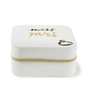 White jewelry box with 'Miss' and 'Mrs.' text and a gold zipper on a white background