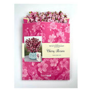 Pop-up flower bouquet packaging with cherry blossom design on a white background