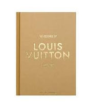 Louis Vuitton notebook with gold cover and white text on a white background