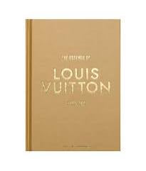 Louis Vuitton notebook with gold cover and white text on a white background