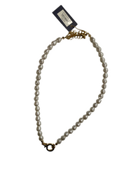 Pearl necklace with gold clasp on a white background