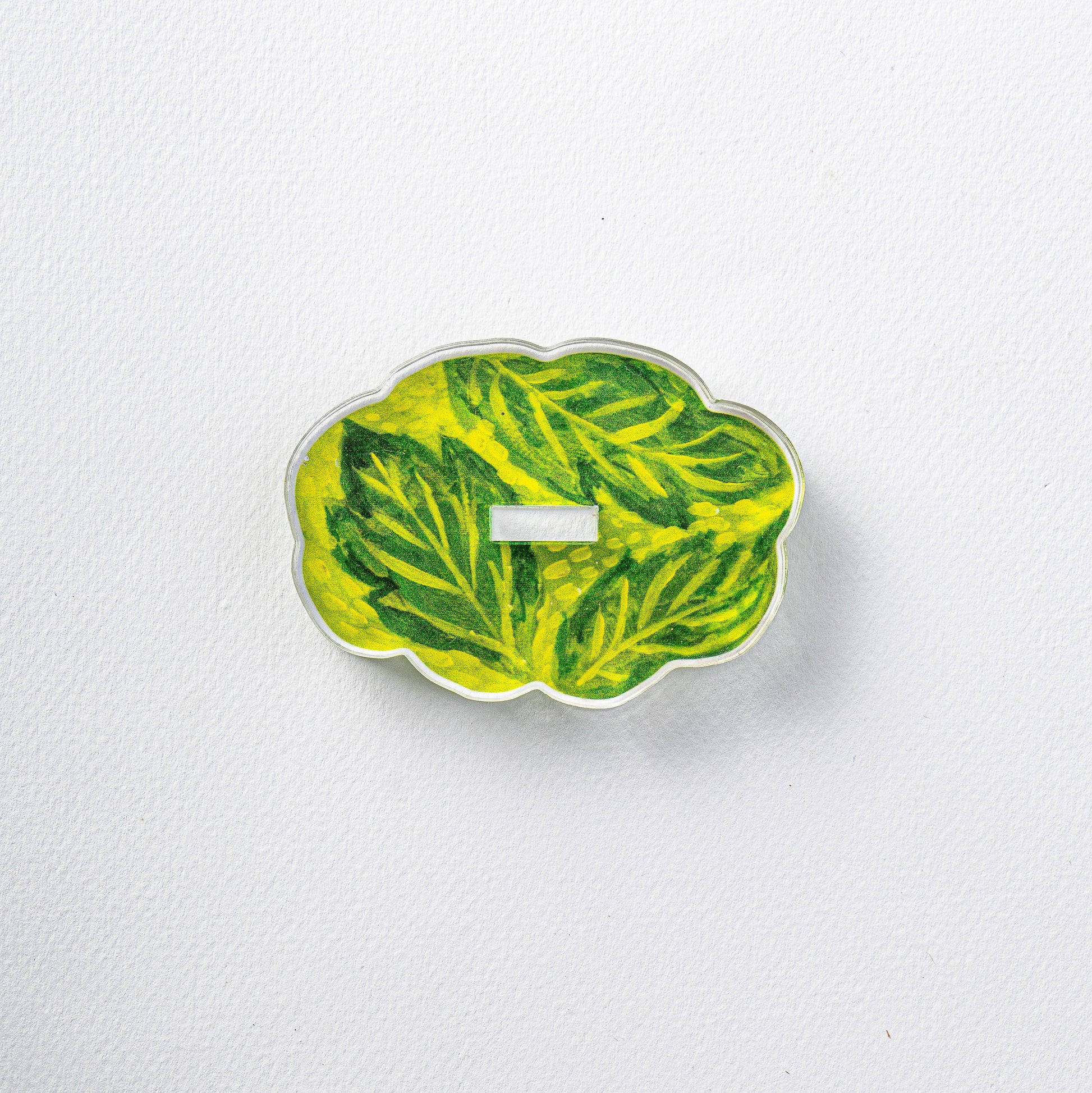 Decorative leaf-patterned object on a white background