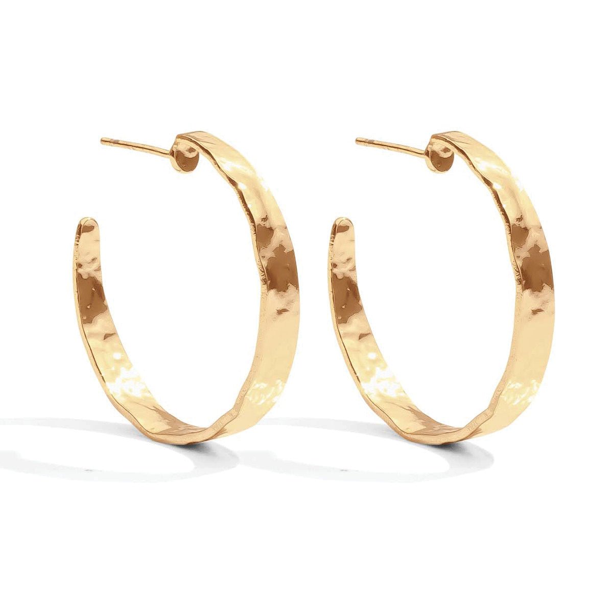 Gold hoop earrings on a white background
