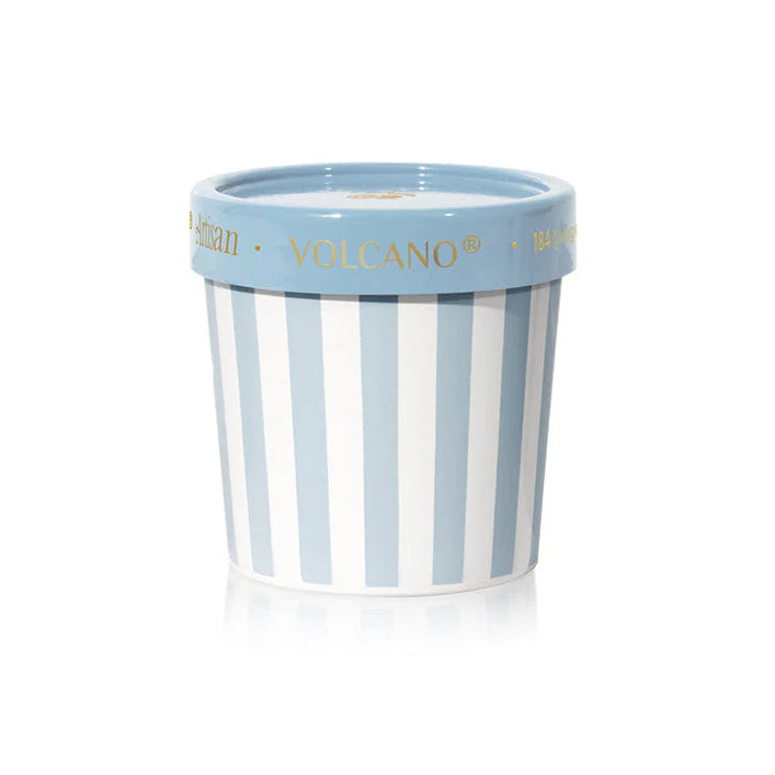 Striped container with blue lid on a white background