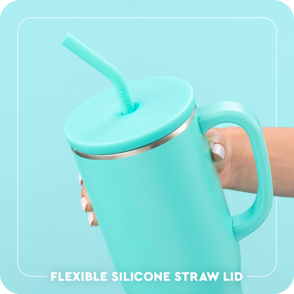 Turquoise mug with handle and flexible silicone straw lid on a light blue background