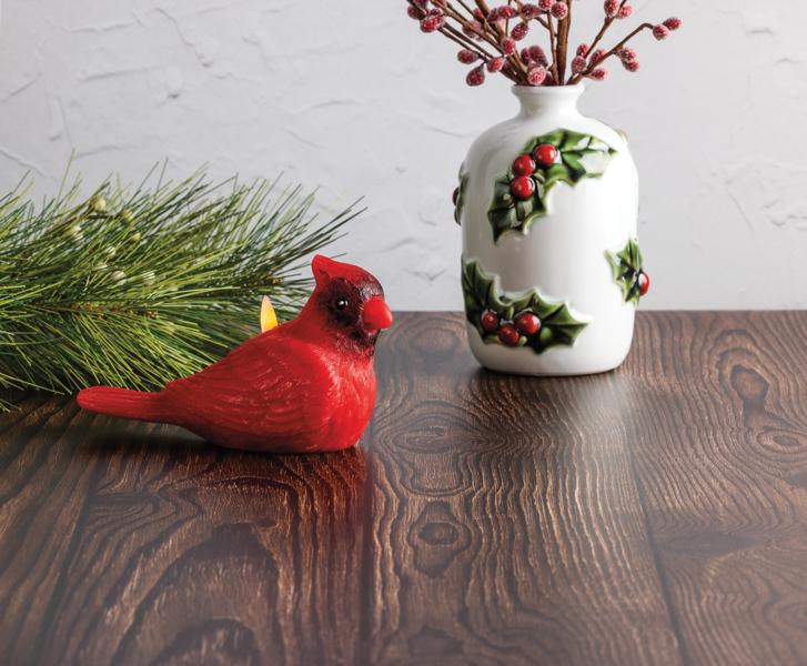Seasonal - Candle - Flameless - Cardinal shaped sitting on wooden table 