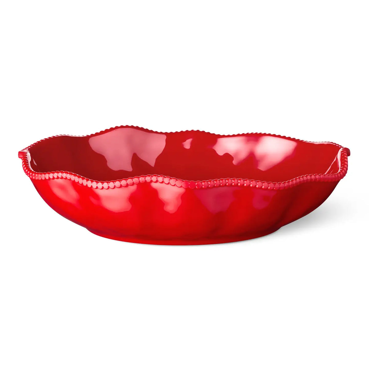 Red melamine bowl with scalloped edge on a white background
