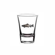 Clear glass shot glass with a fish emblem on a white background