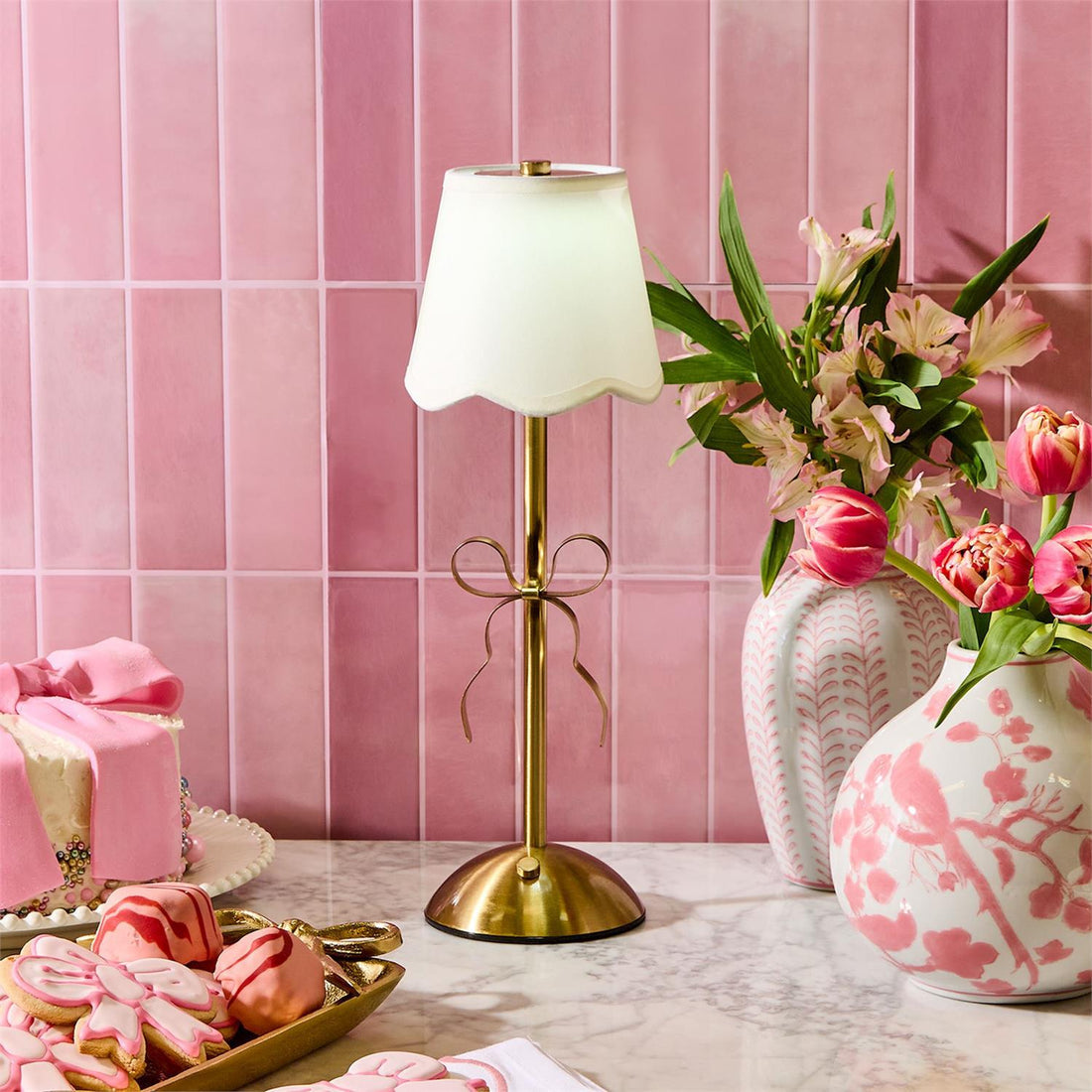 Picture 2 - Gold Bow Lamp on counter with pink tile backsplash 